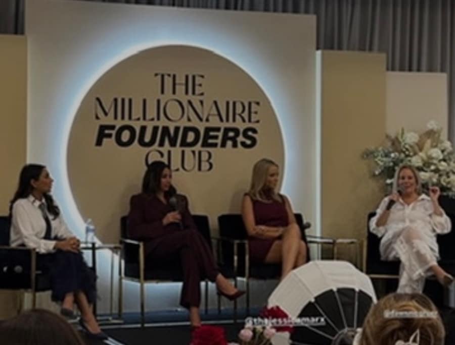 Dawn McGruer speaking on a founder panel at The Millionaire Founders Club