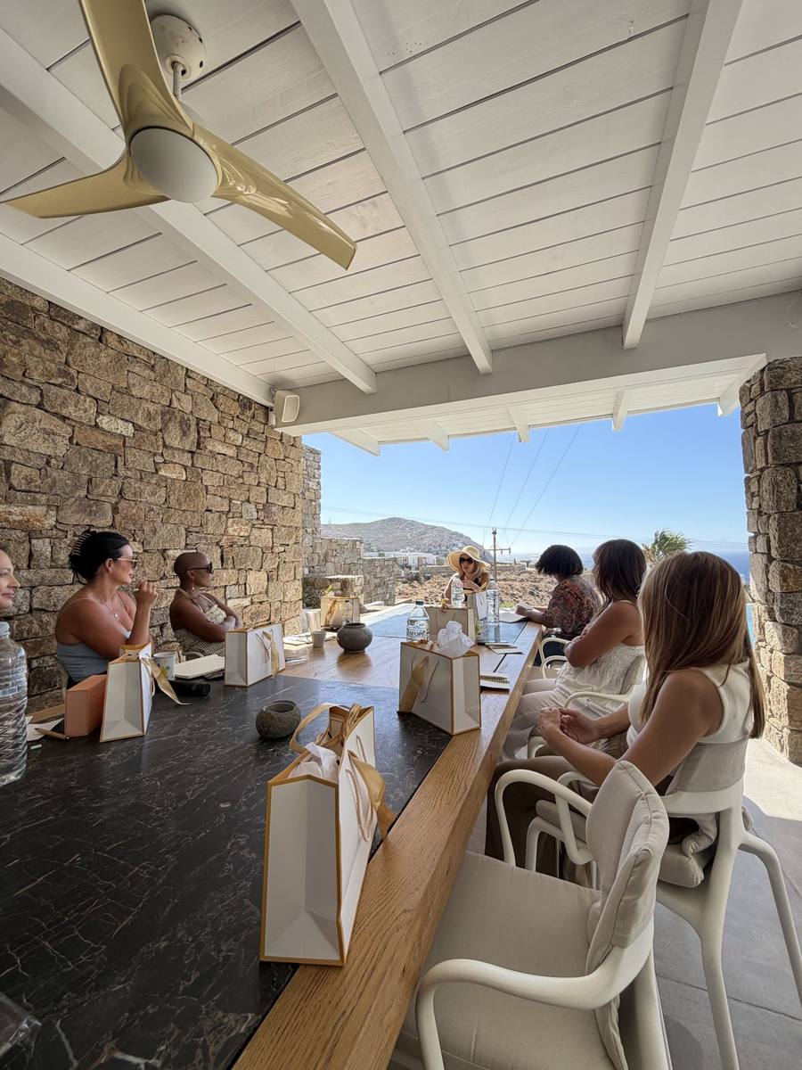 Founders around the table on the retreat terrace