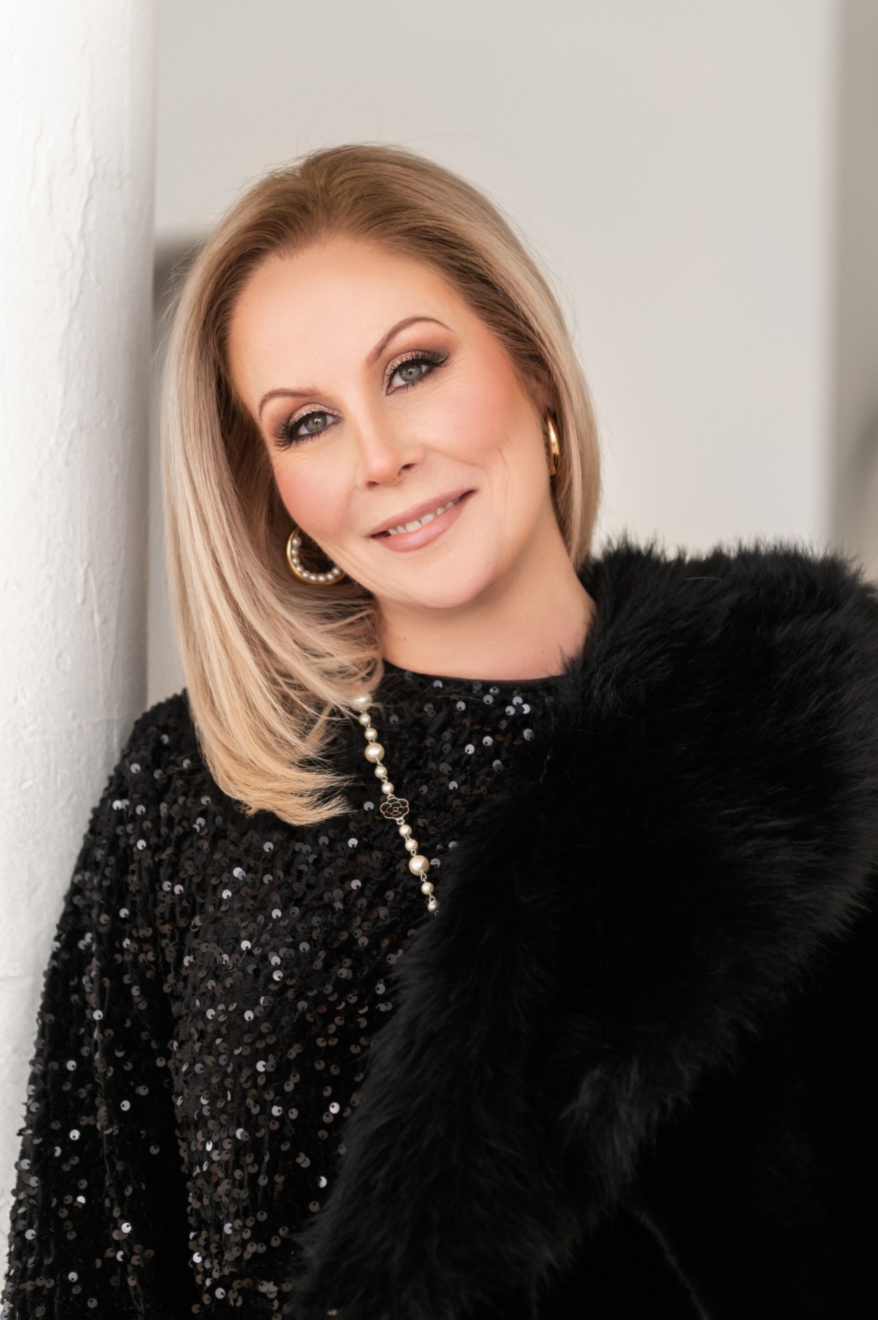 Dawn in black sequins and fur