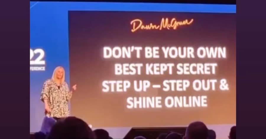 Dawn McGruer presenting on stage at a business growth event