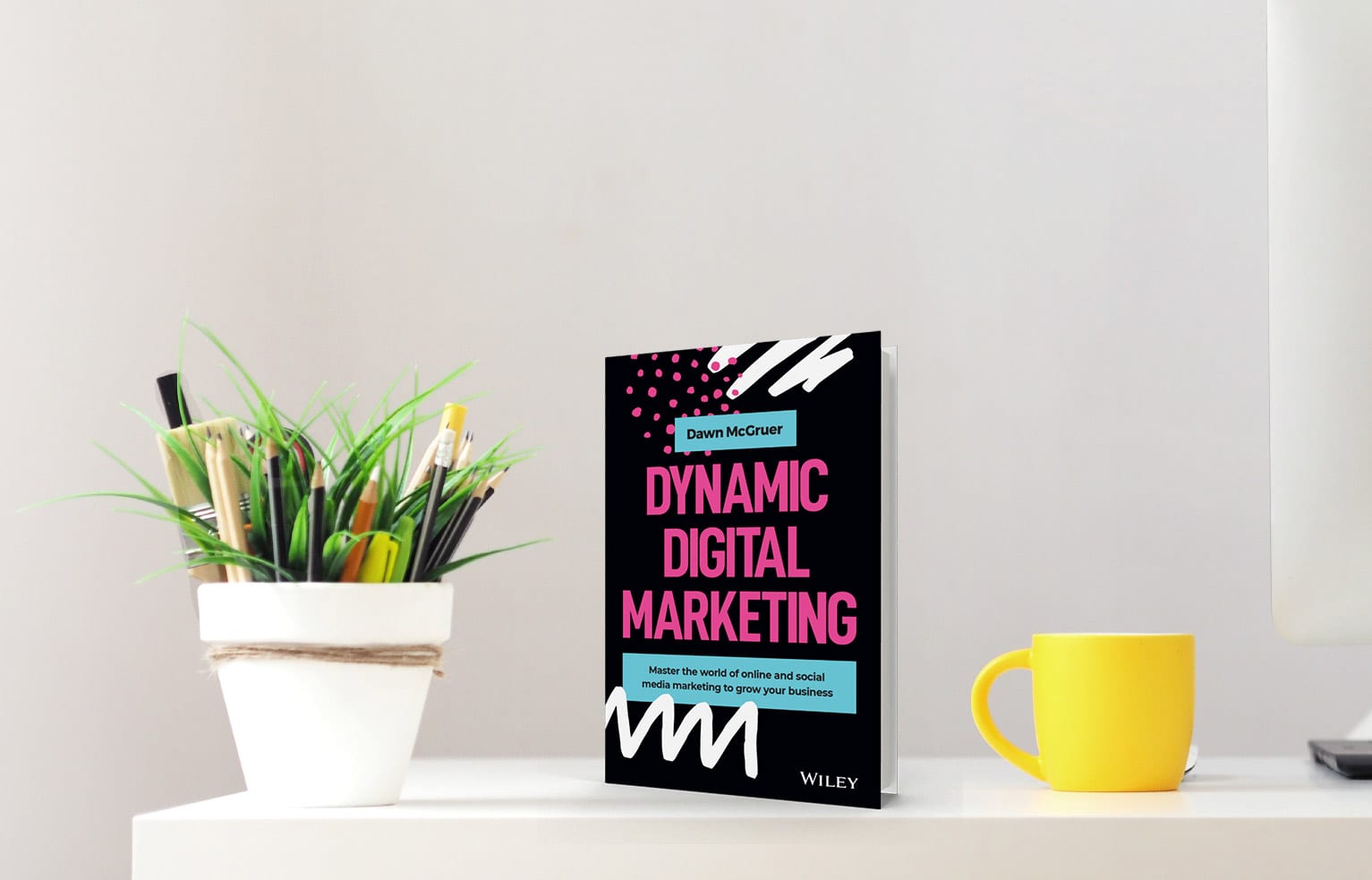 Dynamic Digital Marketing by Dawn McGruer, published by Wiley, displayed on a desk