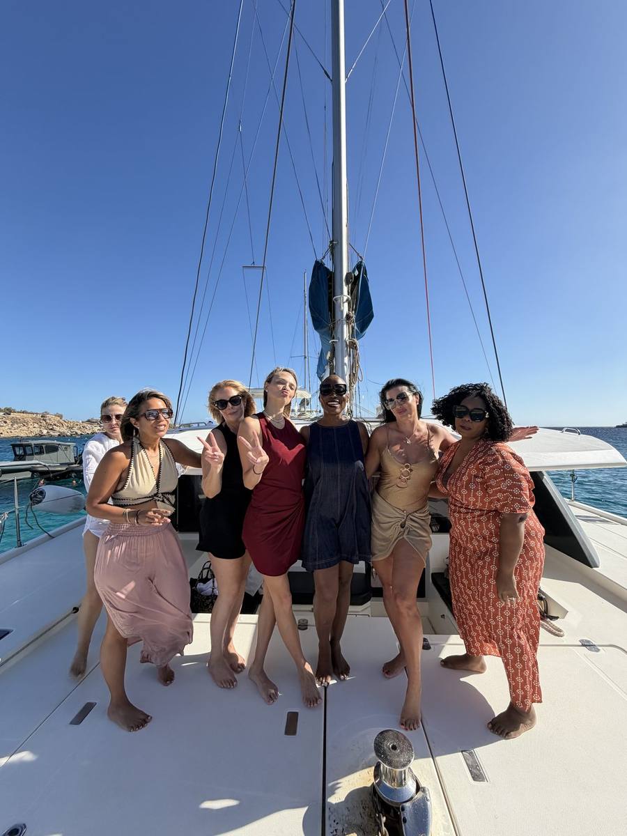 Founders together aboard a private catamaran