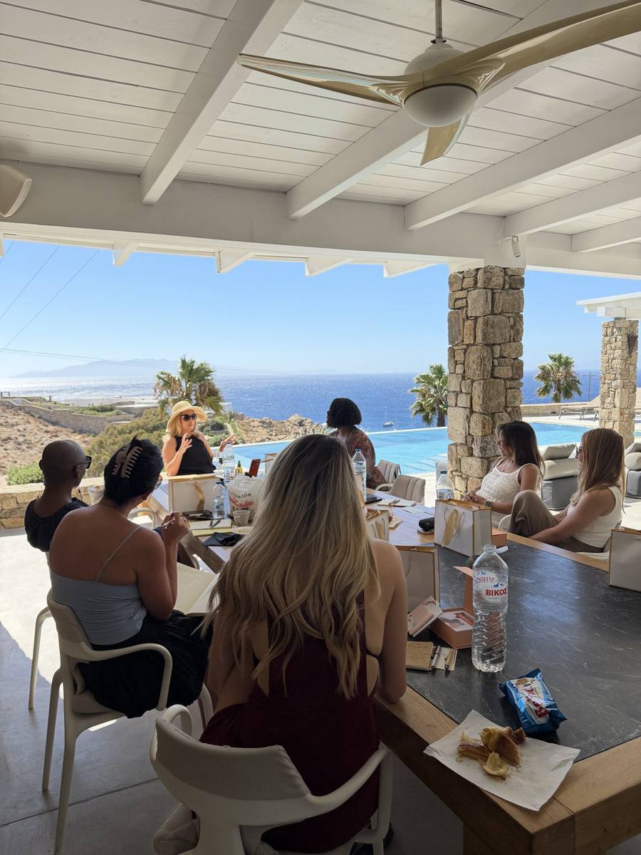 Founders in a strategy session on the villa terrace